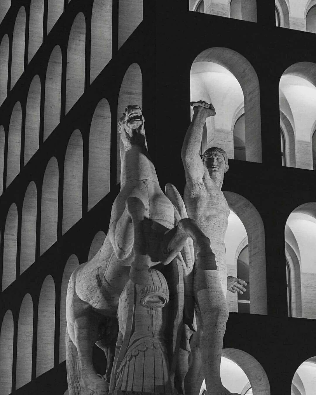 Marble statue of a rearing horse and a raised-arm figure set against a geometric arched stone facade — cgi studio Thinkdiff, from Thinkdiff's copyright law report